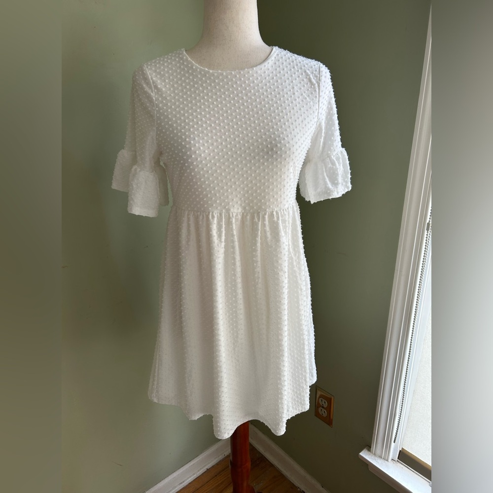 Dee Elly white Swiss dot dress.  Drop waist, short sleeves, round neck. Small